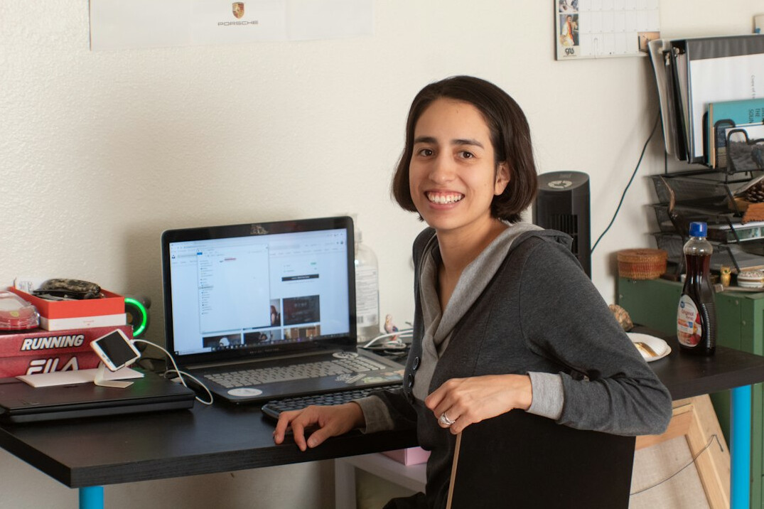 successful programmer at desk