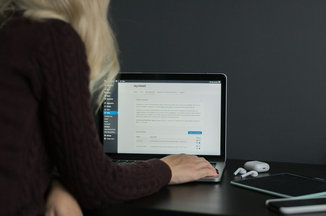 woman coding on laptop
