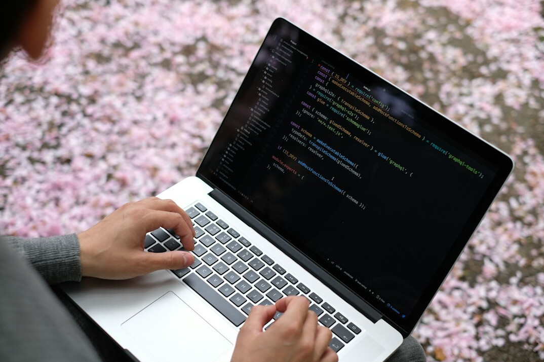 person learning coding on laptop