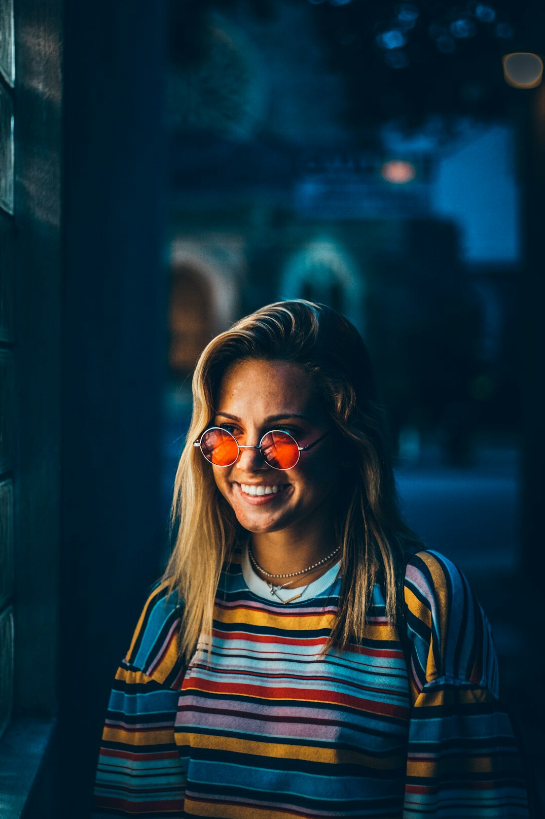 Portrait of a smiling young woman with glasses