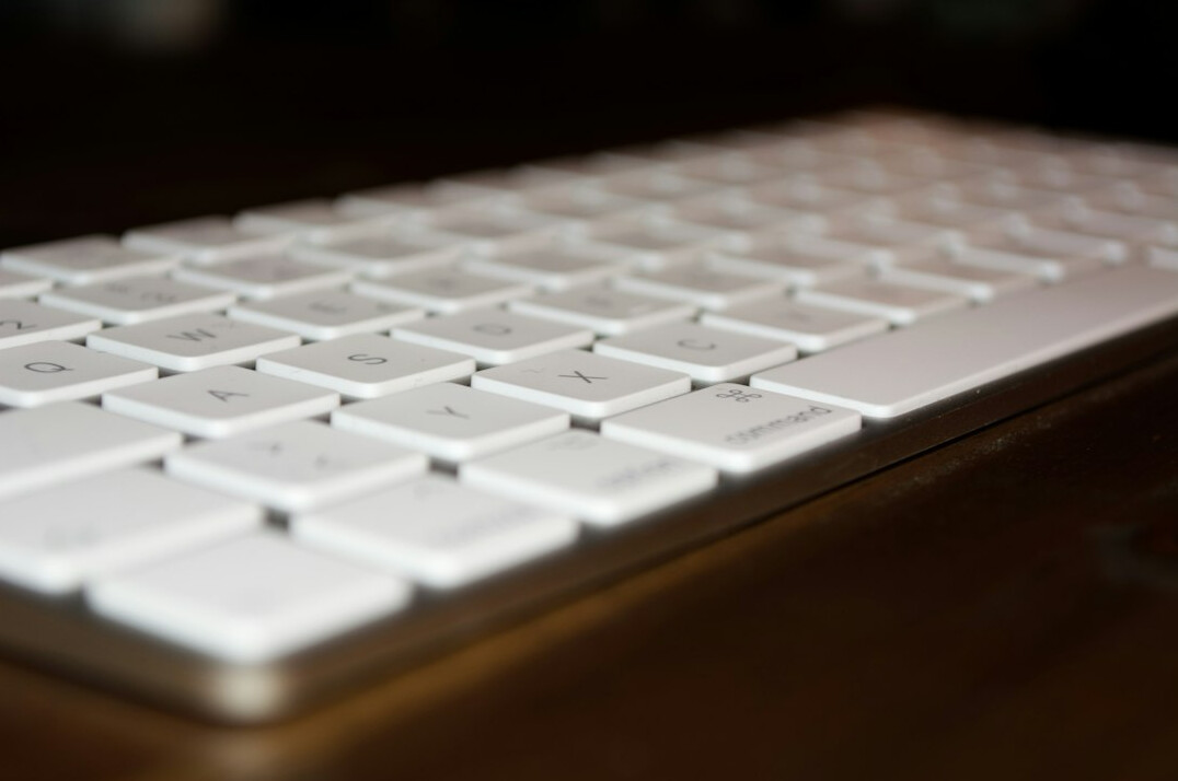 Close-up of hands typing on a keyboard